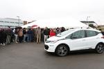 This is at an AutoDrive unveiling event on October 30, 2017. Pictured is the Chevy Volt car and tarp is finished being lifted by students, front view. by Sarah Schuch